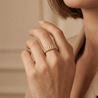 A solid gold ribbed texture wedding ring in 14ct gold by Majestic Jewellery