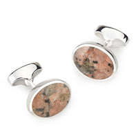 Sterling silver oval cufflinks with Peterhead stone detail, shown in a polished finish by Benson & Clegg.