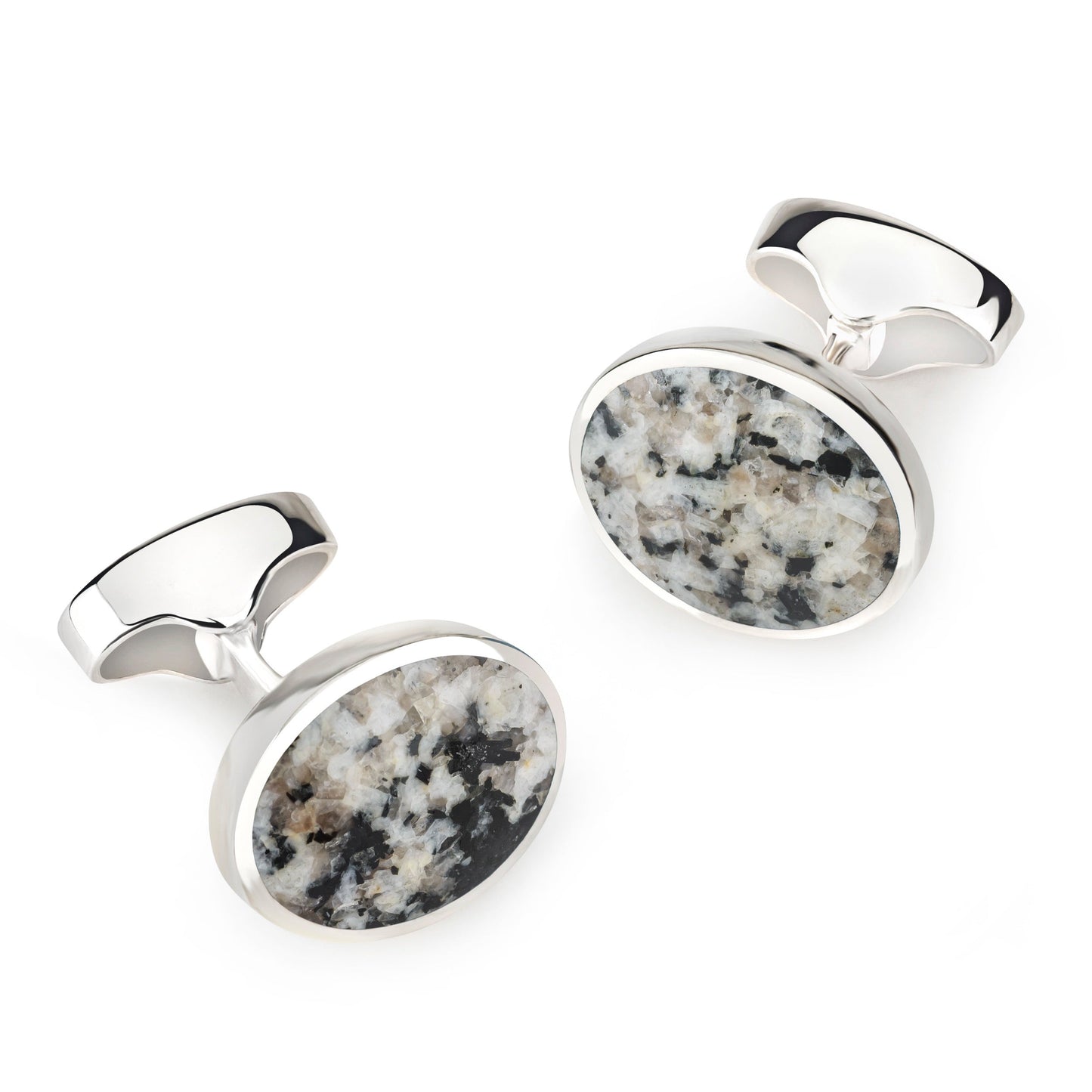 Sterling silver oval cufflinks with a textured Donegal stone finish, detailed close-up shot by Benson & Clegg.