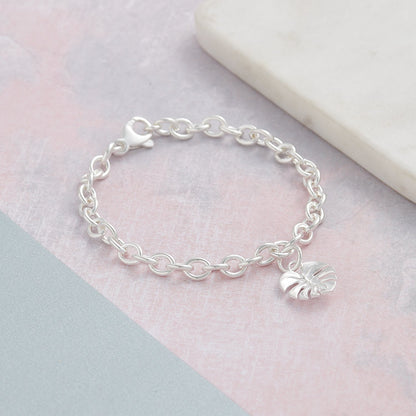 Silver charm bracelet featuring a monstera palm design by Scarlett Jewellery.