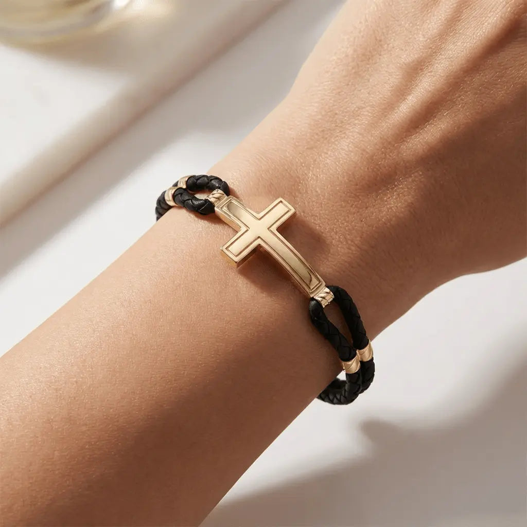 A sleek cross braided bracelet in 14ct gold detail by Majestic Jewellery.