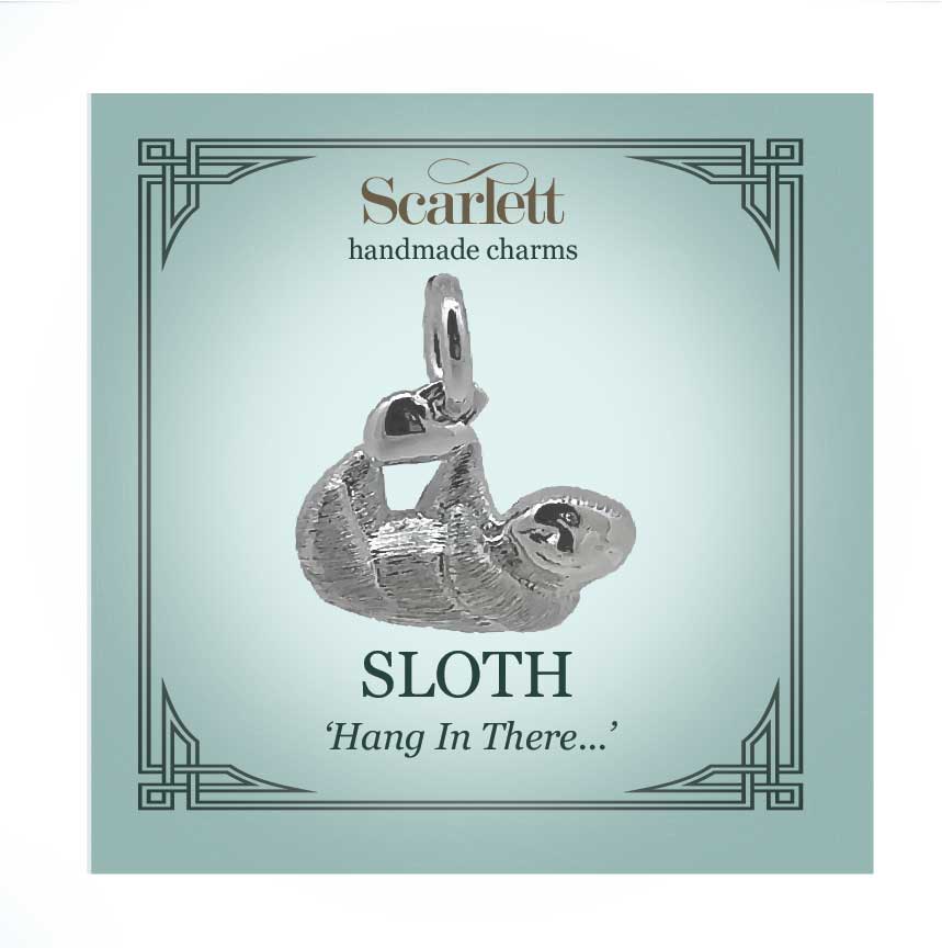 Sloth silver charm with intricate detailing, displayed on a soft pink background by Scarlett Jewellery.