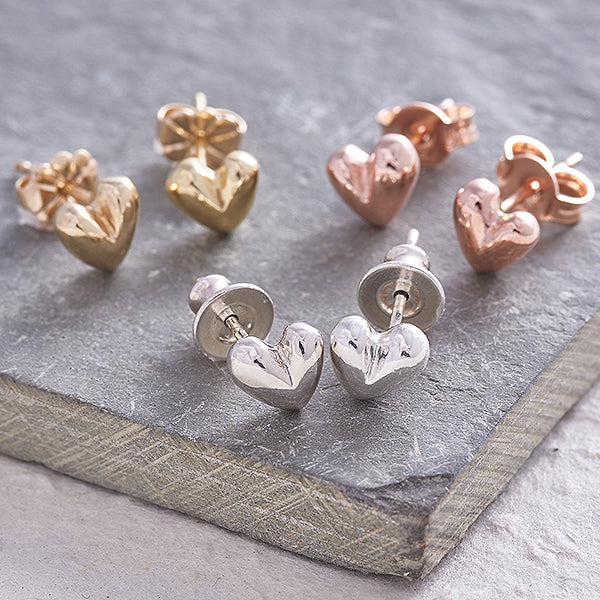 Sweetheart silver stud earrings with delicate heart design by Scarlett Jewellery.