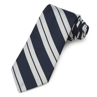 A three-fold silk reppe tie in navy blue with a subtle pattern, displayed flat on a white background, by Benson & Clegg.