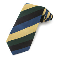 A deep navy blue three-fold silk reppe tie with a subtle textured pattern worn on a white shirt by Benson & Clegg.