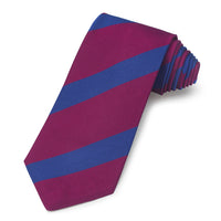 A deep navy three-fold silk reppe tie with a subtle pattern, displayed on a wooden stand, by Benson & Clegg.