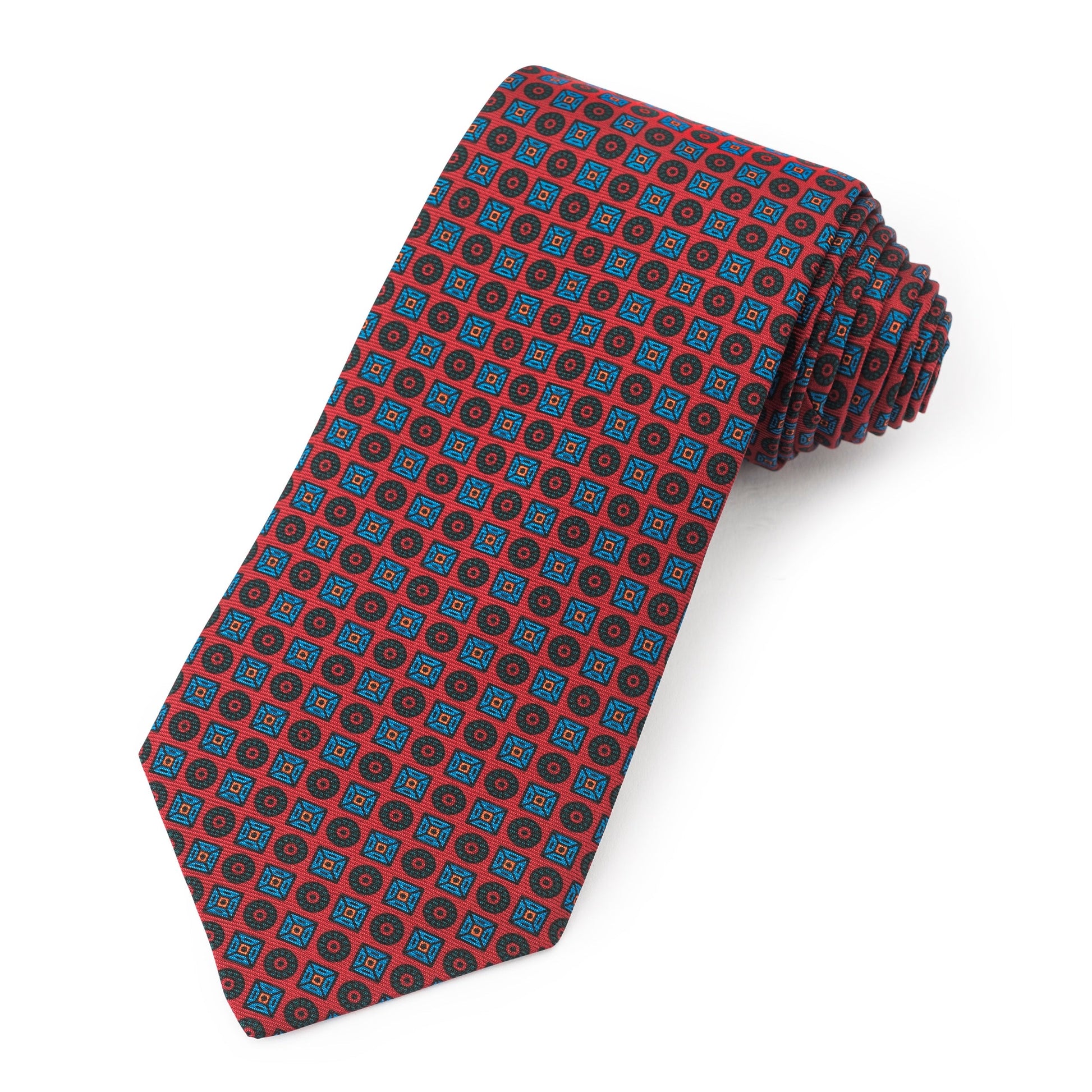A red silk tie featuring square and circle patterns in ancient madder dye, displayed flat with detailed texture, by Benson & 