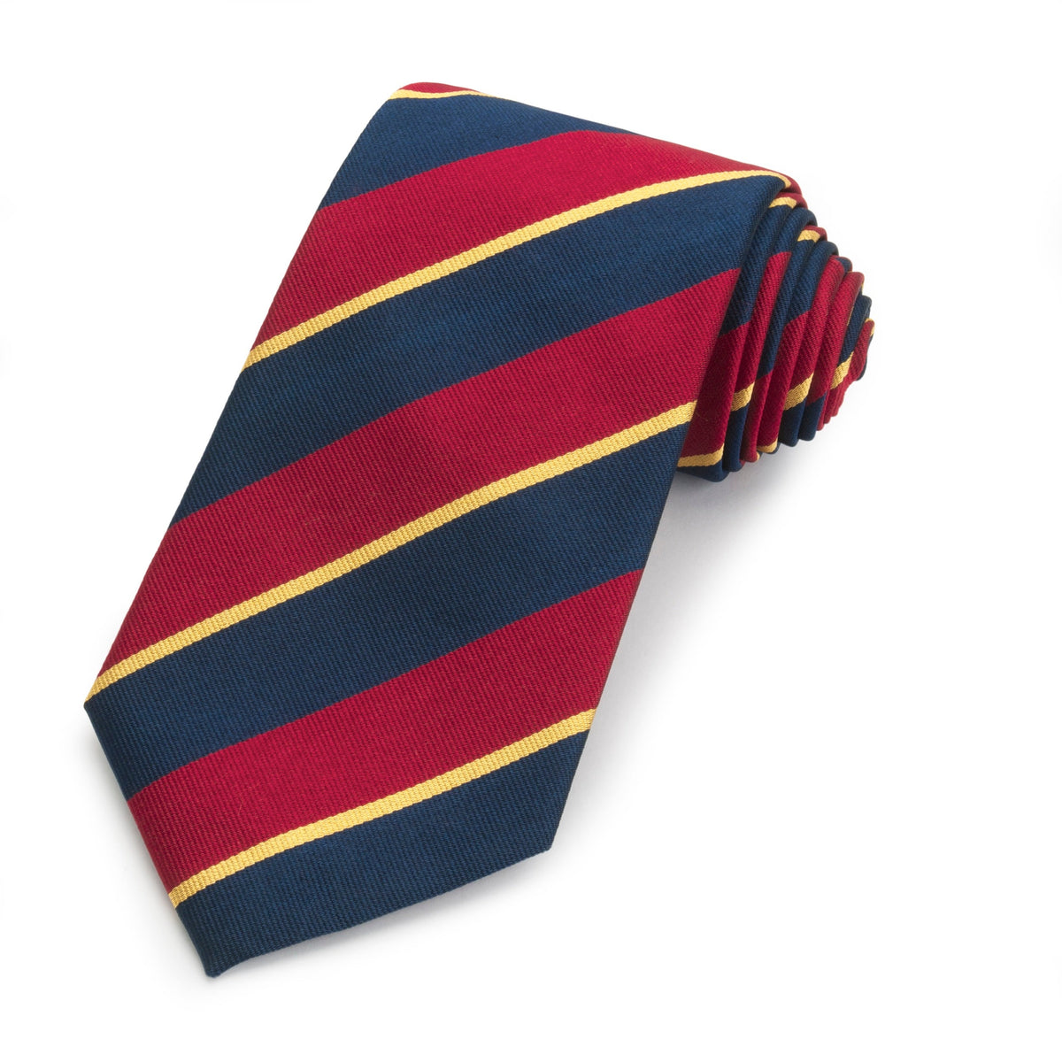 Dark blue three-fold silk reppe tie with intricate pattern, worn on a formal shirt by Benson & Clegg.
