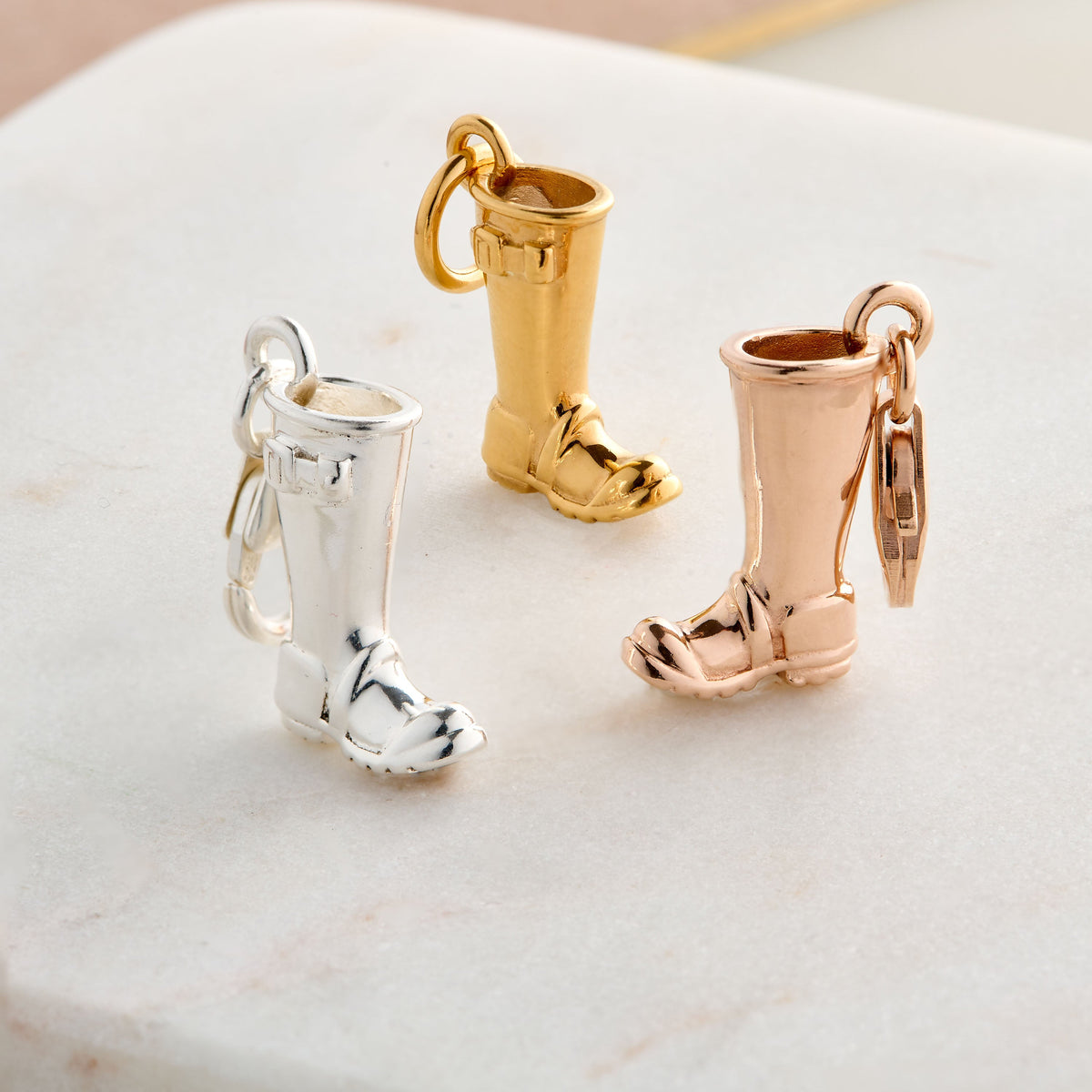Silver charm with personalized engraving on a welly boot by Scarlett Jewellery.