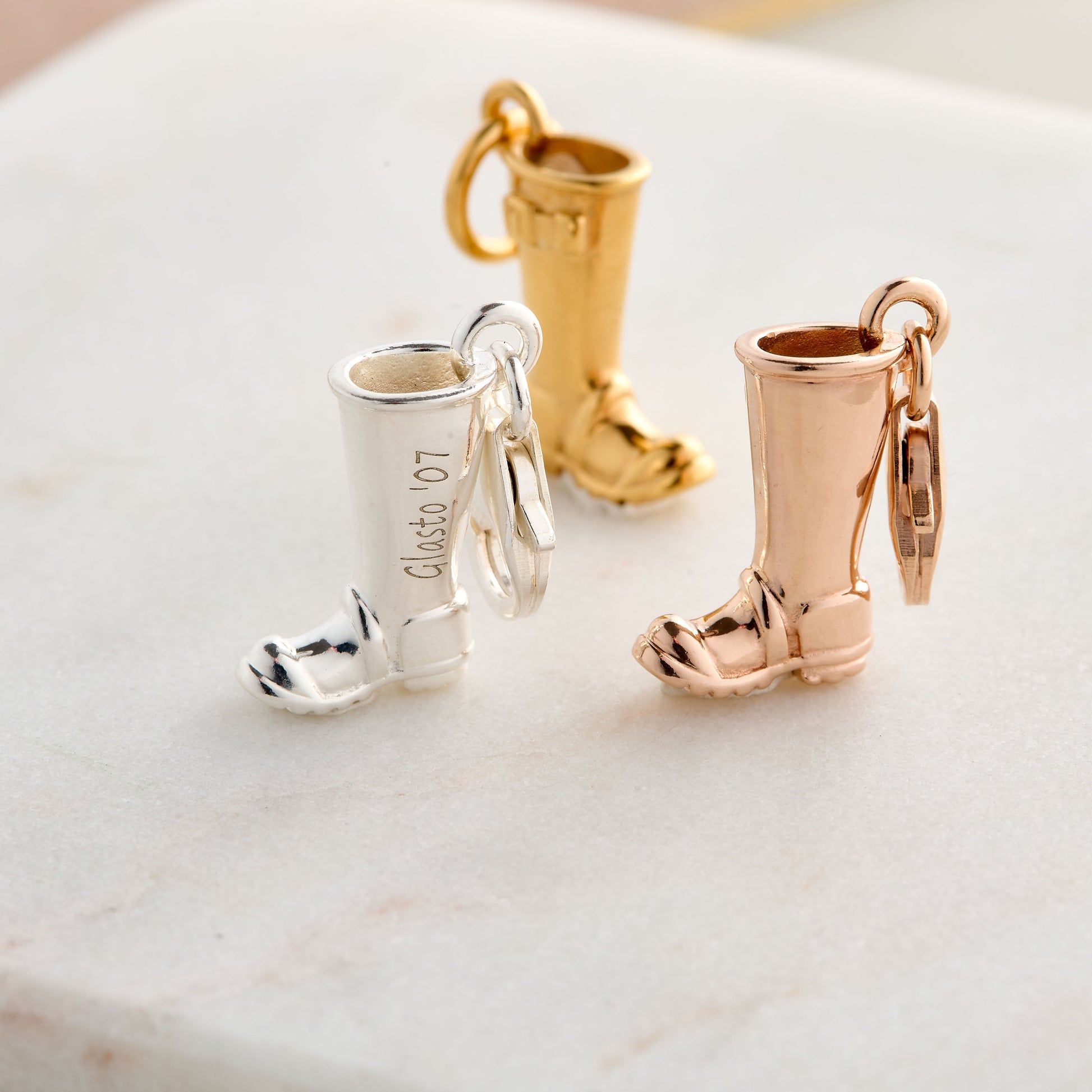 Silver welly boot with personalized charm and engraved details by Scarlett Jewellery.