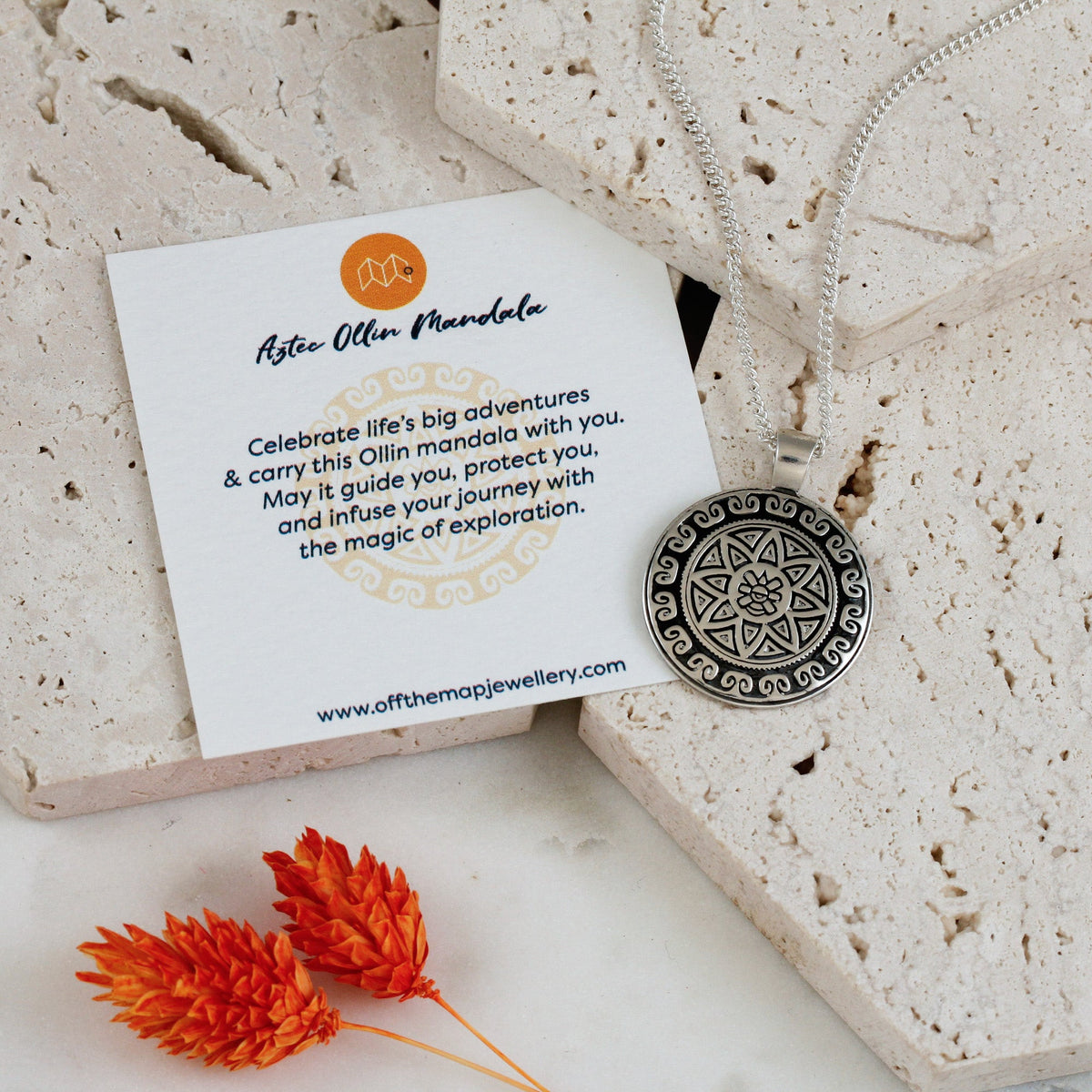 Silver necklace featuring an Aztec Ollin travel mandala design with personalized engraving by Scarlett Jewellery.