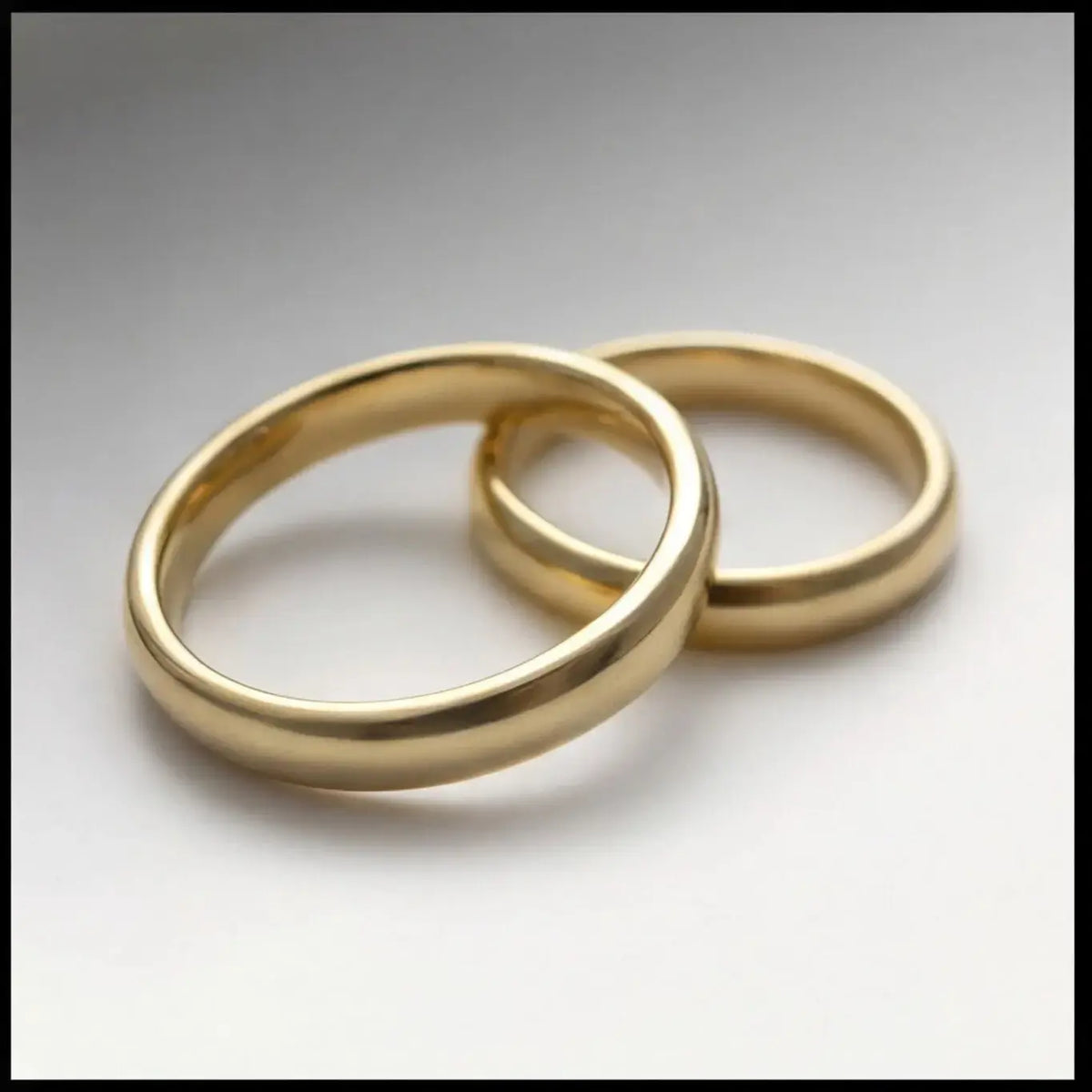 A 3mm gold wedding band featuring a classic lyra design in 9ct gold, displayed horizontally with a subtle shine by Majestic J