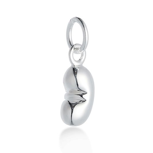 Silver baby bean charm with delicate detailing, displayed on a white background by Scarlett Jewellery.