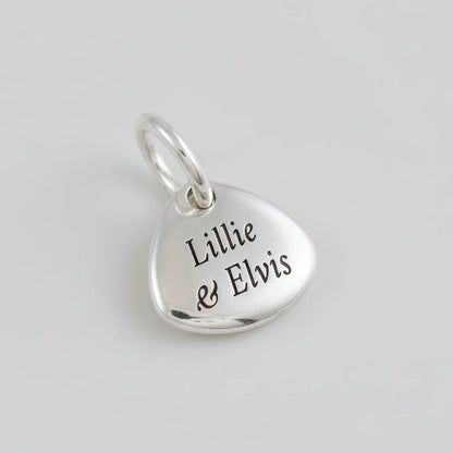 Silver paw print charm with personalized engraving, part of the Scarlett Jewellery charm collection.
