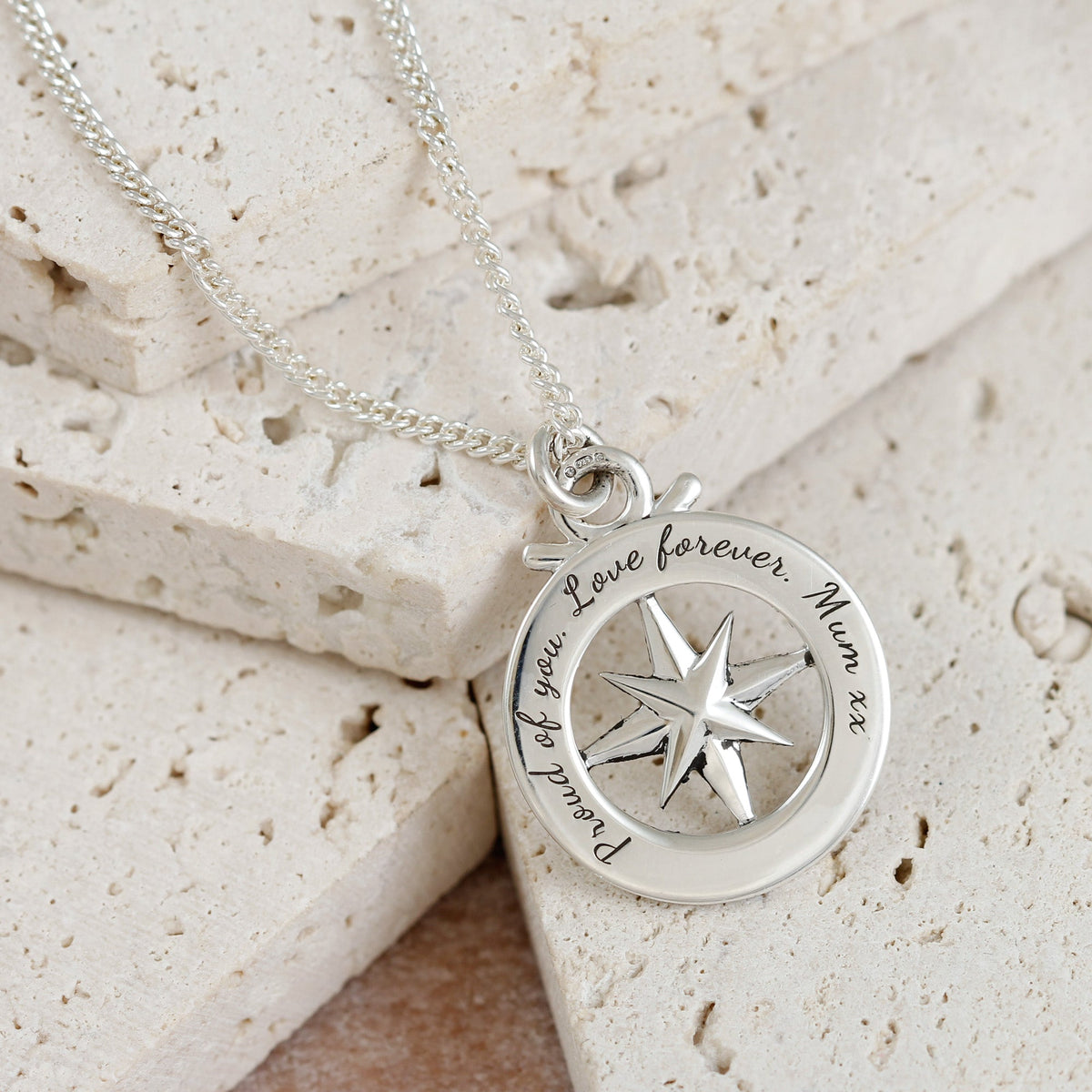Large silver necklace featuring a travel safe outline compass design by Scarlett Jewellery
