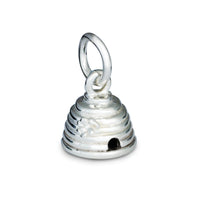 A silver beehive charm with intricate detailing, displayed on a soft fabric background, by Scarlett Jewellery.