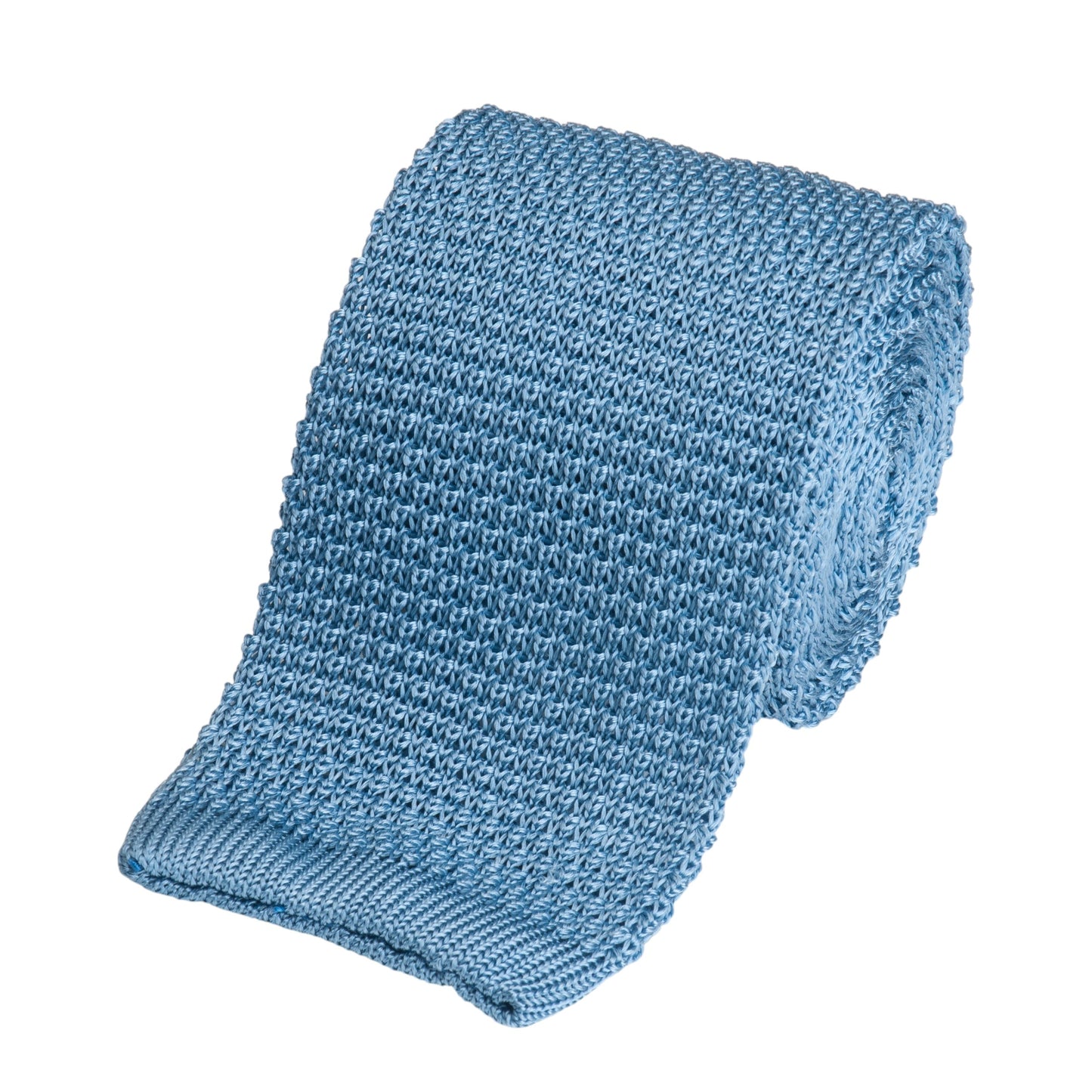 A knitted silk tie in sky blue with a subtle texture, shown folded neatly on a white background.