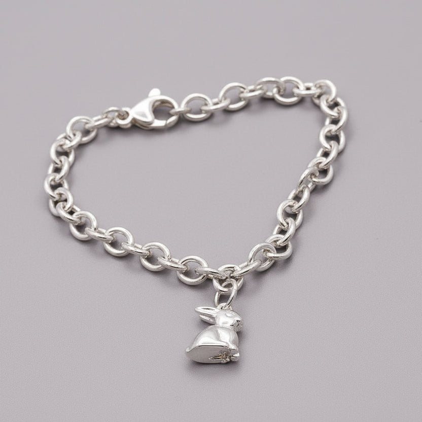Silver bunny rabbit charm with detailed features, displayed on a soft background, by Scarlett Jewellery.