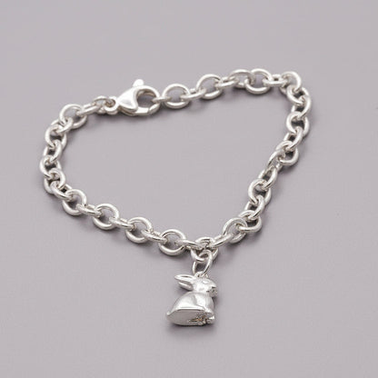 Silver bunny rabbit charm with detailed features, displayed on a soft background, by Scarlett Jewellery.