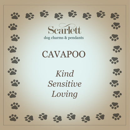 A silver cavapoo dog charm shaped like a small dog, detailed with a smooth finish and delicate features, by Scarlett Jeweller