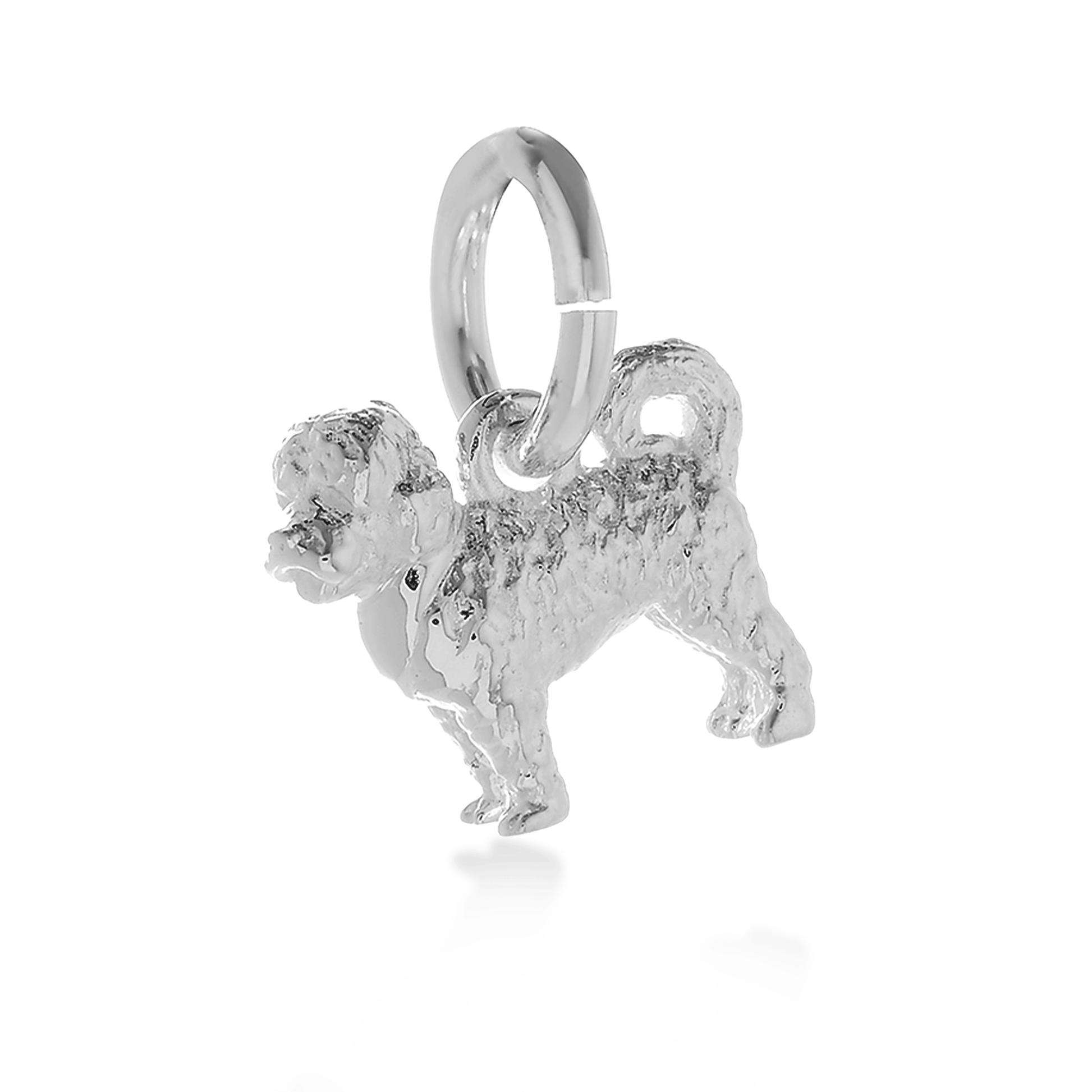 Silver dog charm shaped like a cavapoo, detailed with realistic features, by Scarlett Jewellery.