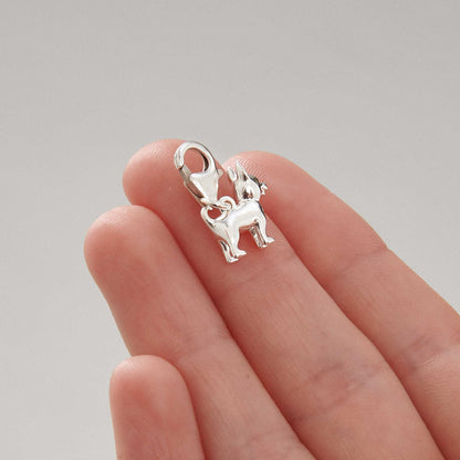 A small silver chihuahua dog charm with detailed facial features by Scarlett Jewellery.