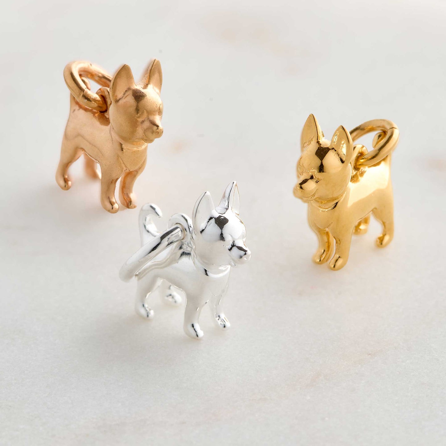A silver chihuahua dog charm with detailed facial features by Scarlett Jewellery