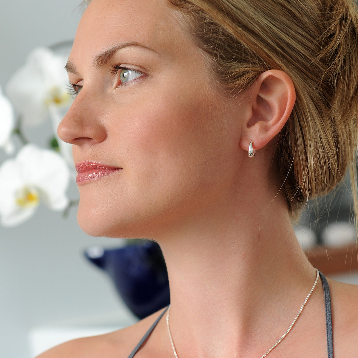 Silver hoop earrings with a classic huggie design by Scarlett Jewellery