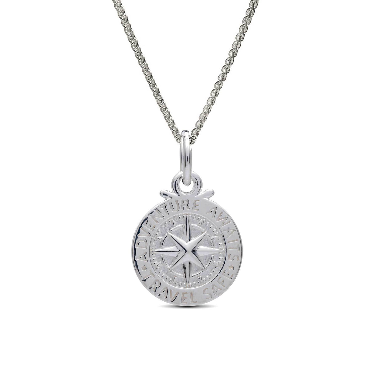 Silver compass charm with personalized engraving, styled on a jewelry display by Scarlett Jewellery.
