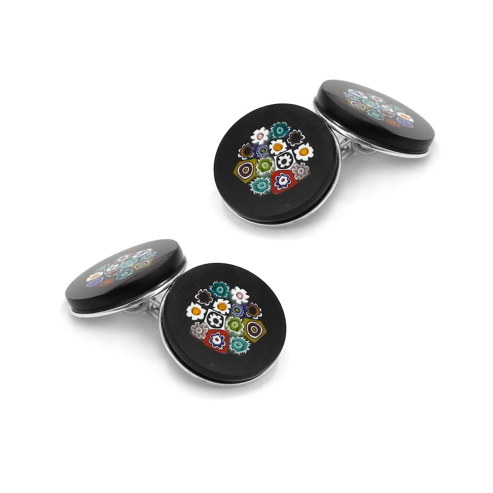 Murano glass cufflinks with floral patterns in blue and gold, sterling silver backs, shown close-up.