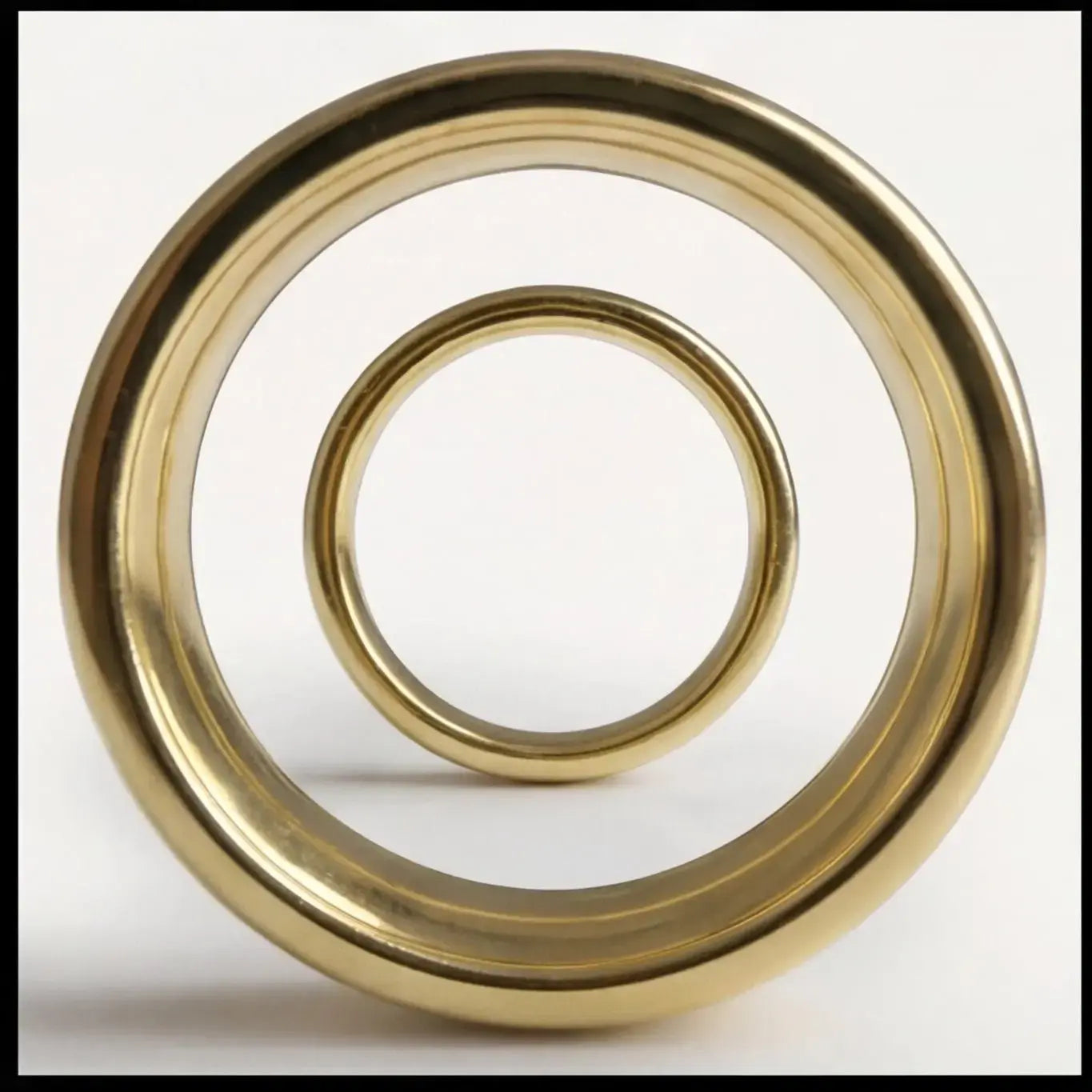 A 3mm gold wedding band featuring a classic lyra design in 14ct gold worn on a finger by Majestic Jewellery.