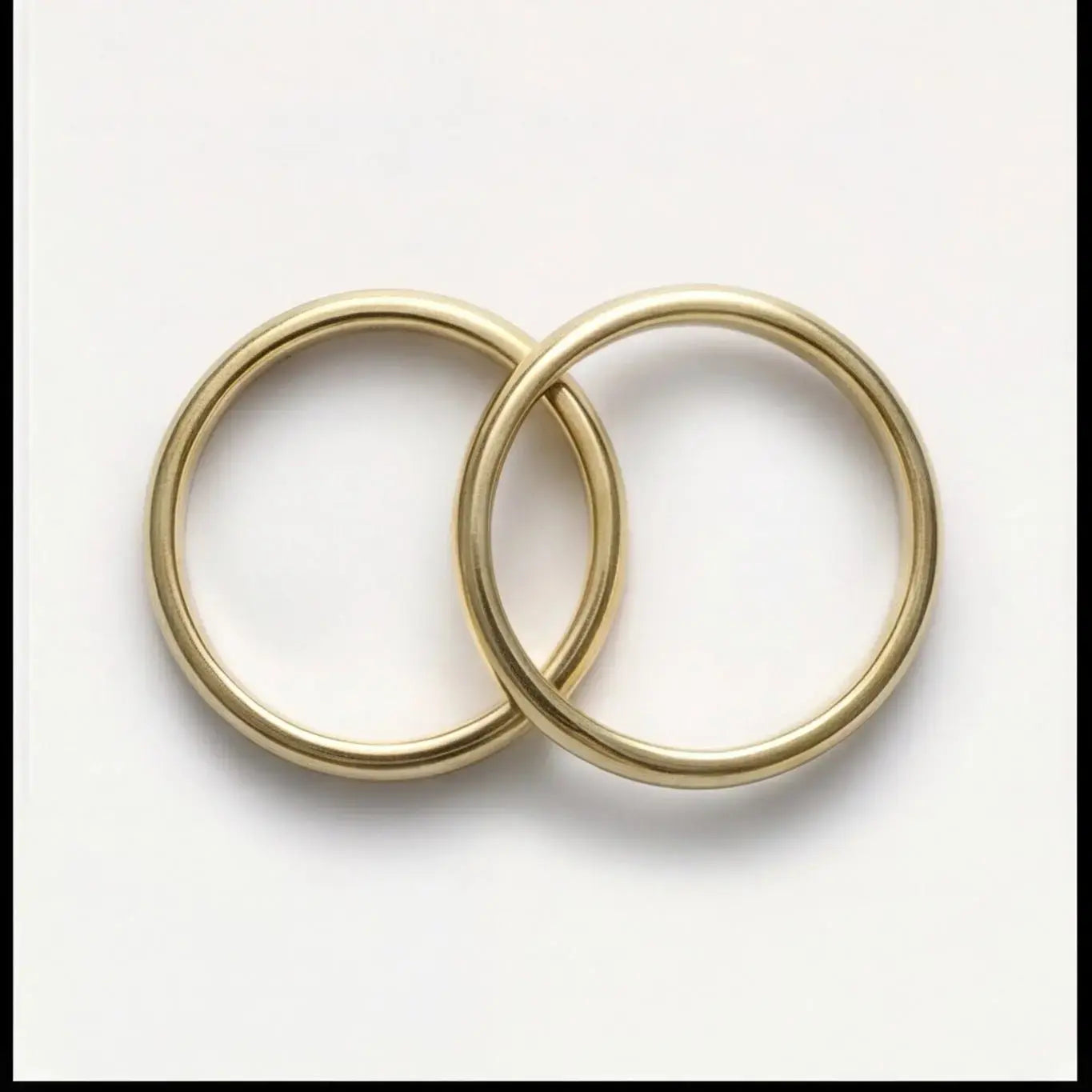 A 3mm gold wedding band featuring a classic lyra design in 9ct gold, displayed horizontally with a subtle shine by Majestic J