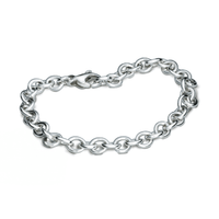 A silver mini lifetime charm bracelet with a delicate chain and personalized charms by Scarlett Jewellery.