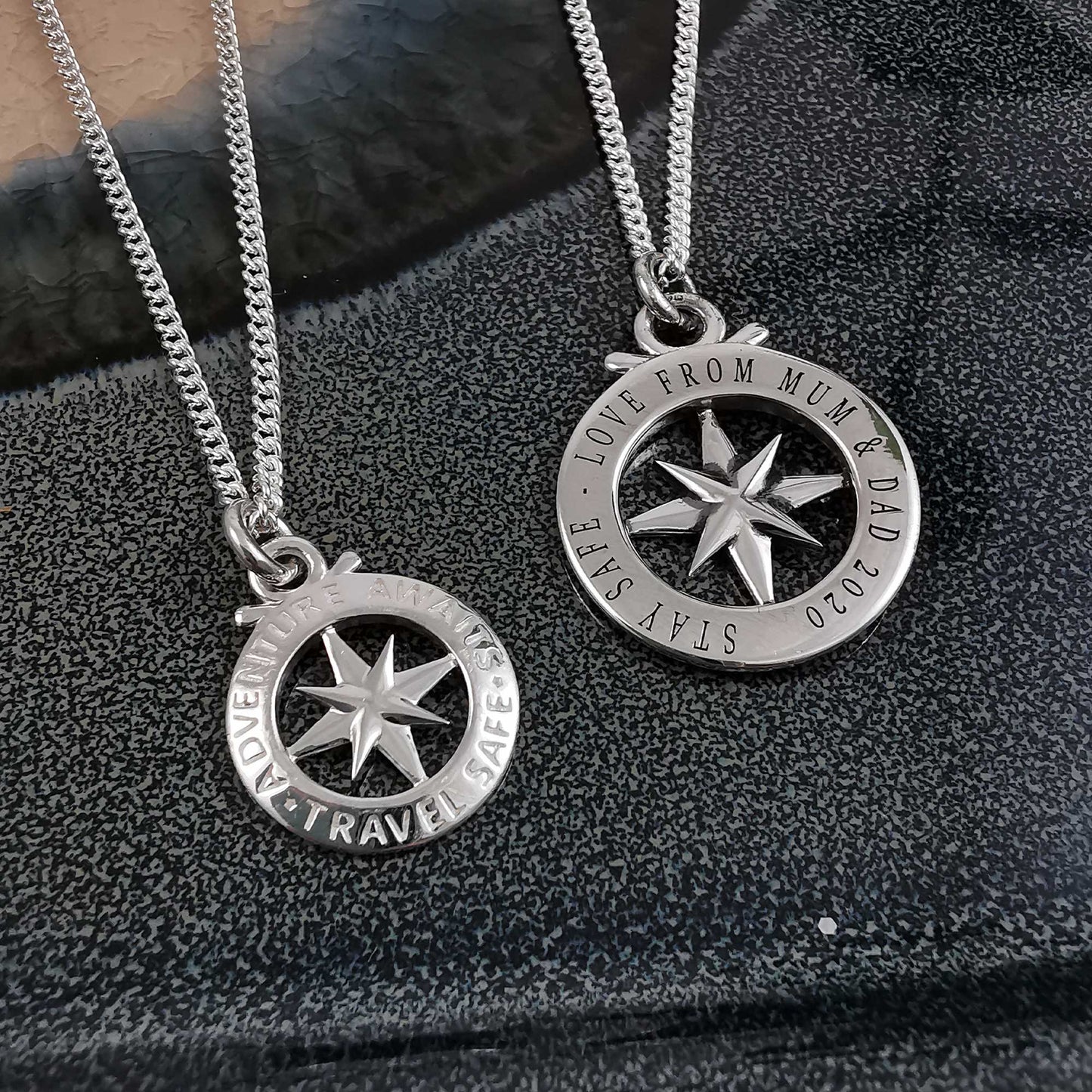 Large silver compass necklace featuring an outline of St Christopher, styled as a pendant by Scarlett Jewellery.
