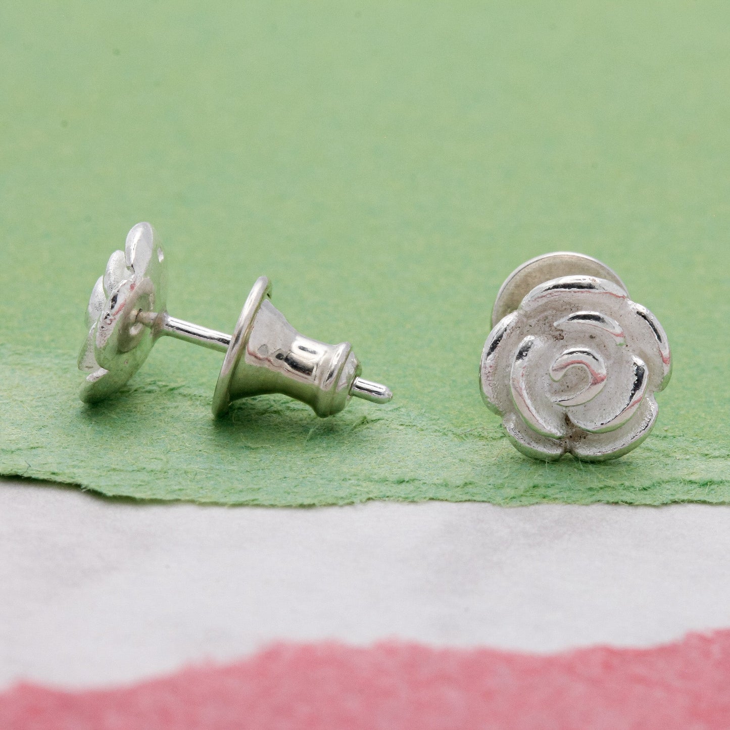Rose flower silver stud earrings with detailed petal texture by Scarlett Jewellery.