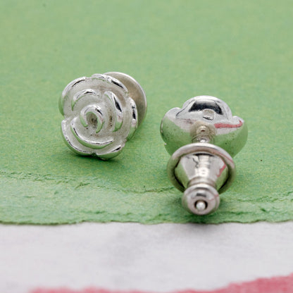 Silver stud earrings featuring a delicate rose flower design by Scarlett Jewellery.