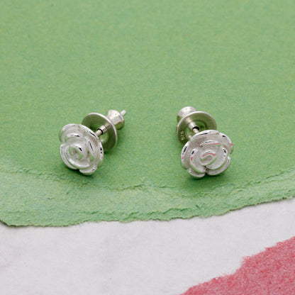 Silver rose flower stud earrings with detailed petal texture by Scarlett Jewellery.