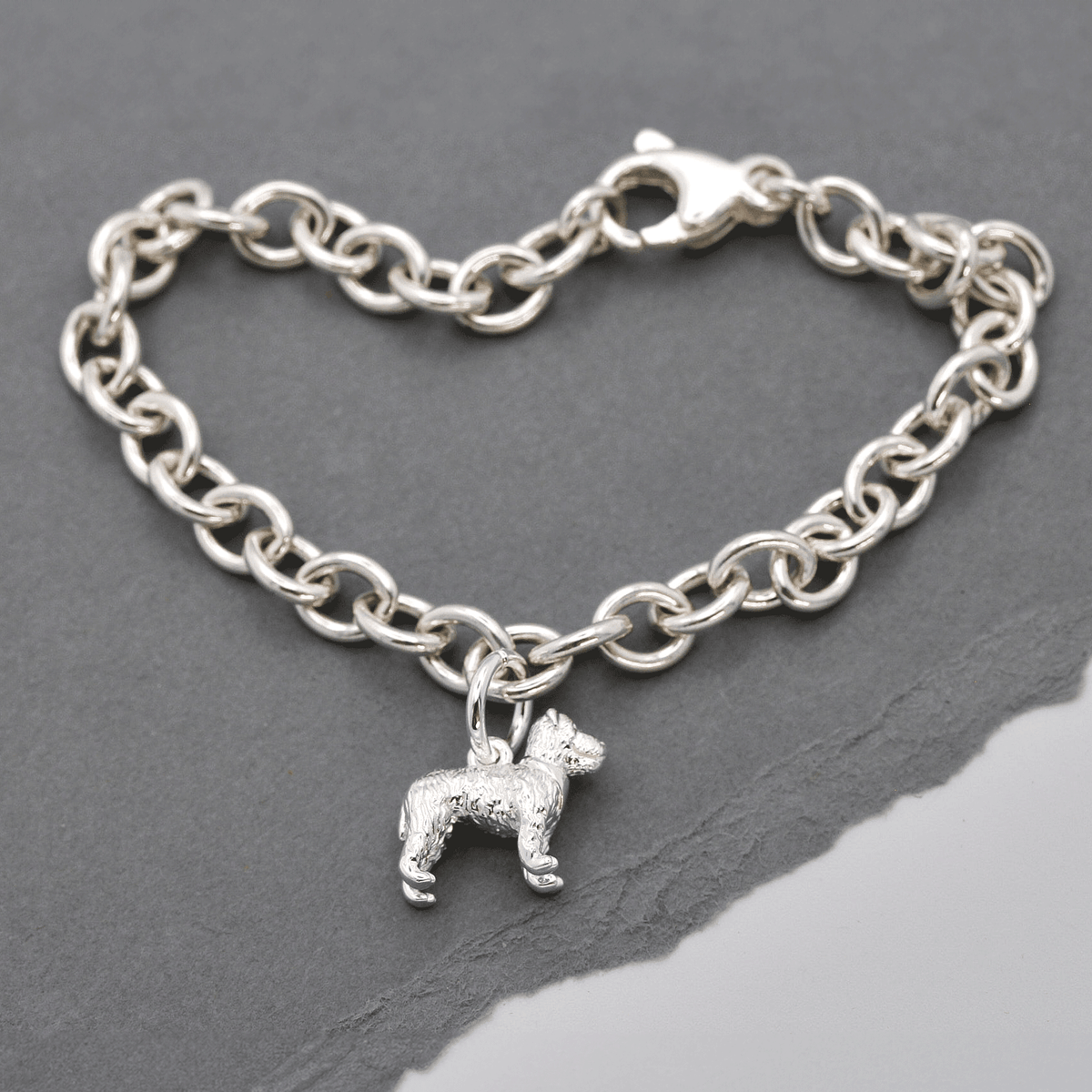 Silver fox terrier dog charm hanging from a chain by Scarlett Jewellery