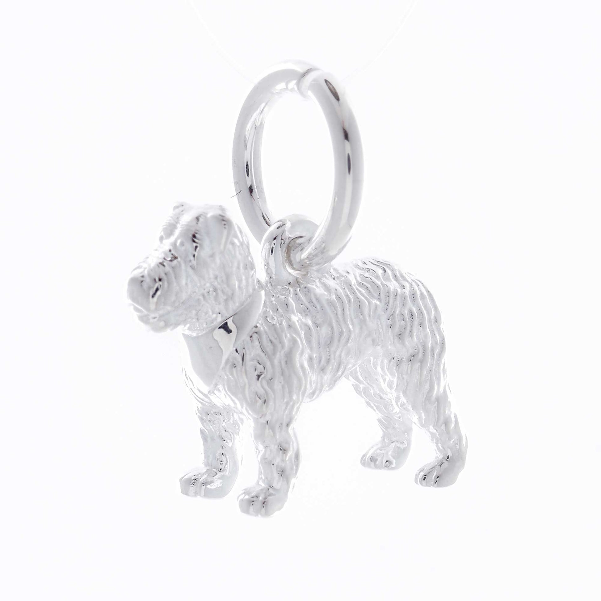 A silver fox terrier dog charm shaped like a paw print, displayed on a white background by Scarlett Jewellery.