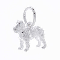 A silver fox terrier dog charm shaped like a paw print, displayed on a white background by Scarlett Jewellery.