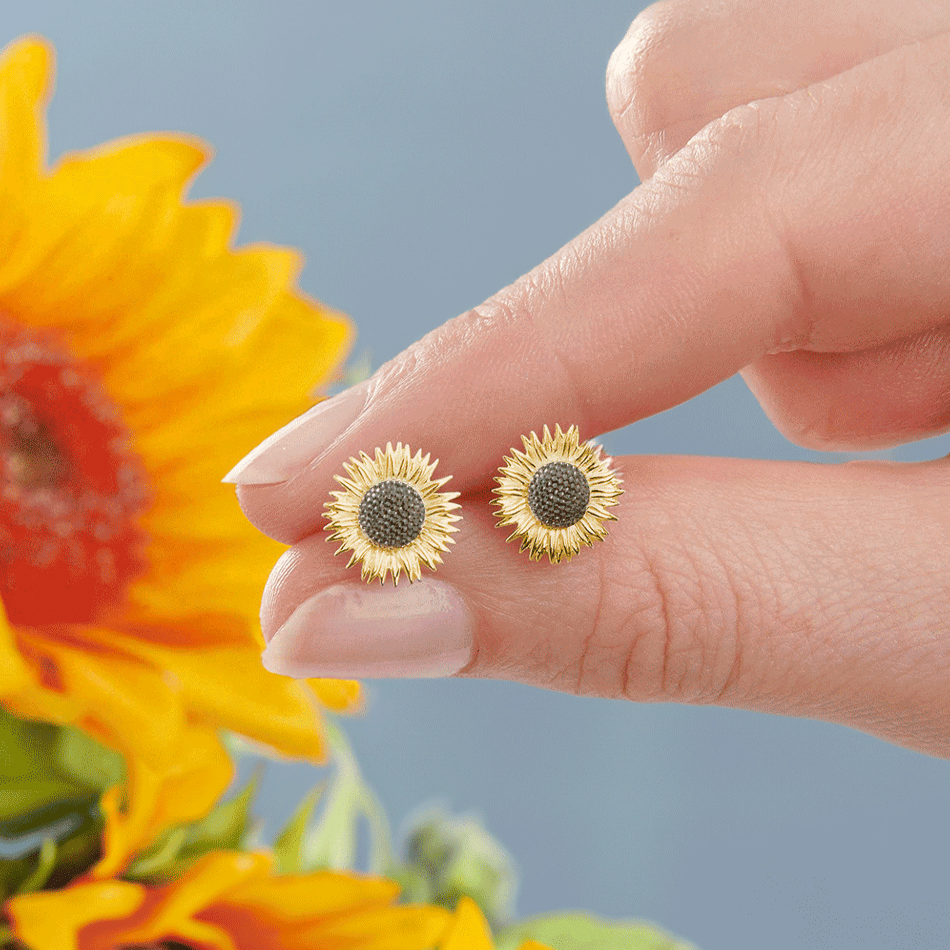 Sunflower silver and gold vermeil stud earrings with intricate floral details by Scarlett Jewellery.