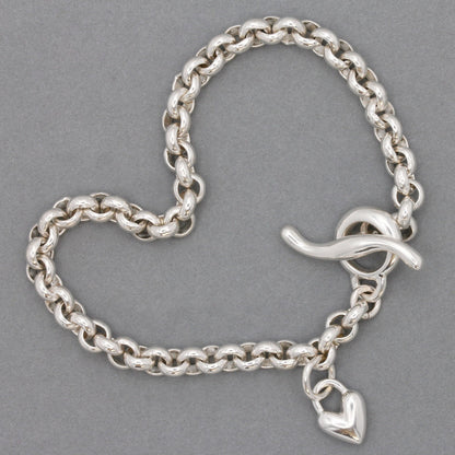 A silver heart belcher chain charm bracelet with a detailed heart charm by Scarlett Jewellery.