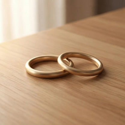 A slim gold wedding band set featuring a 2mm width in 9ct, 14ct, and 18ct gold by Majestic Jewellery.