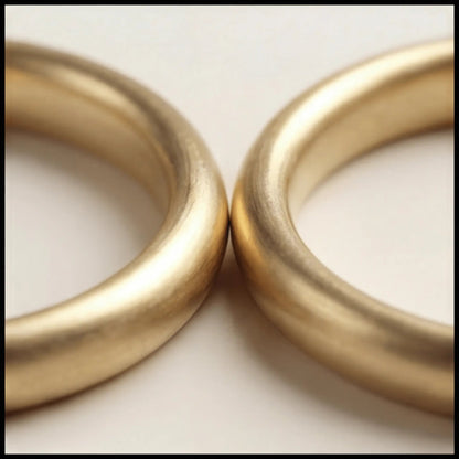 A slim gold wedding band set featuring a 2mm width in 9ct, 14ct, and 18ct gold by Majestic Jewellery.