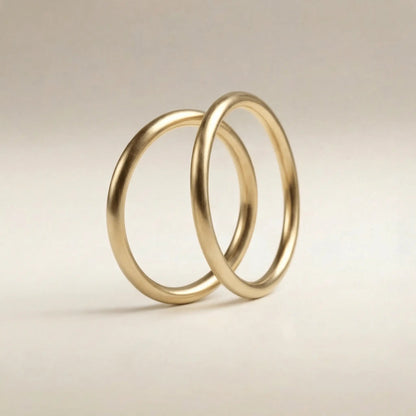 A slim gold wedding band set featuring a 2mm width in 9ct, 14ct, and 18ct gold by Majestic Jewellery.