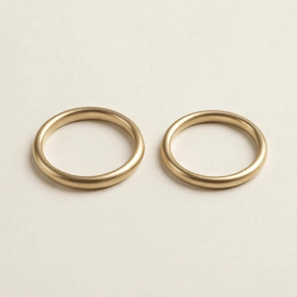 A slim gold wedding band set featuring a 2mm width in 9ct, 14ct, and 18ct gold by Majestic Jewellery.