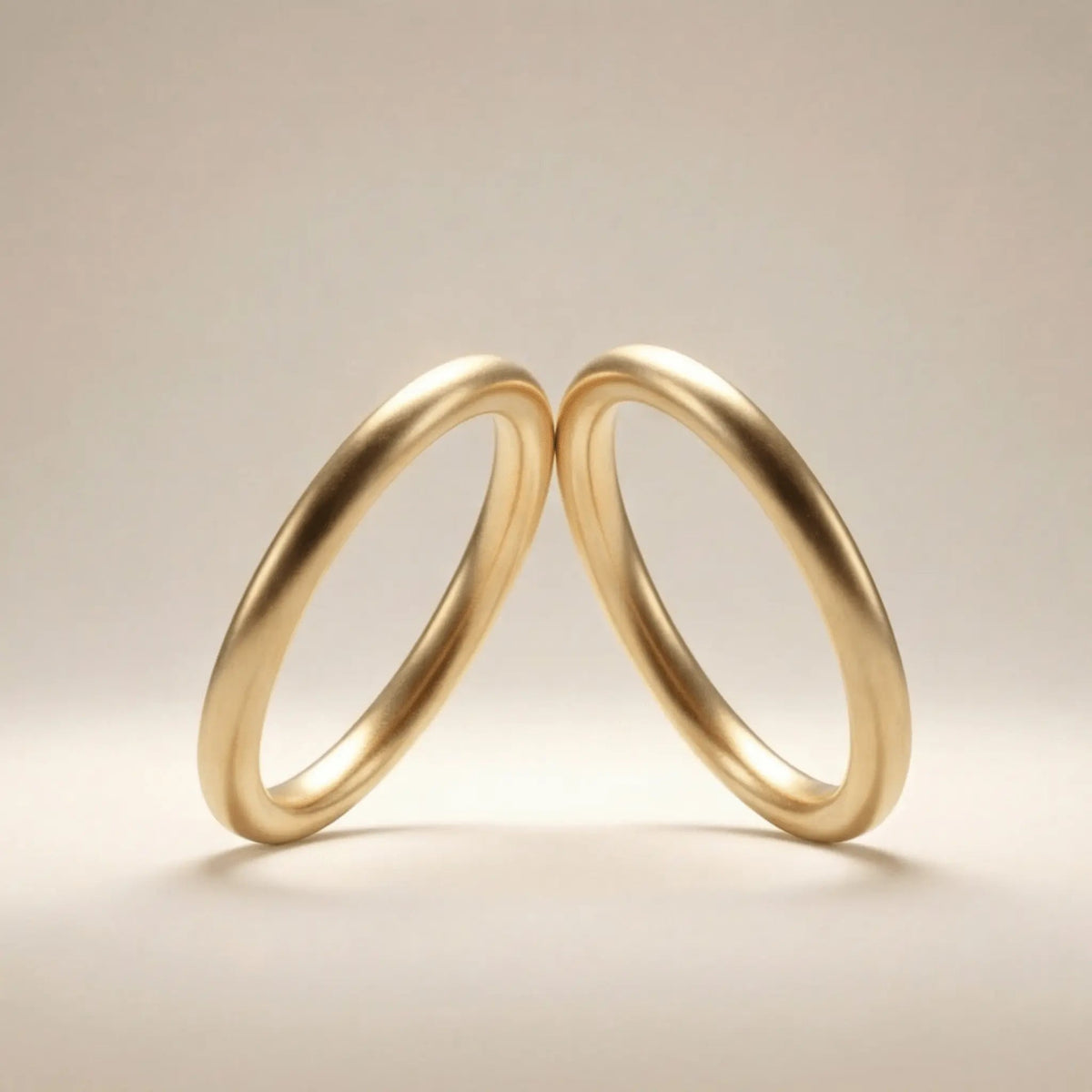 A slim gold wedding band set featuring a 2mm width in 9ct, 14ct, and 18ct gold by Majestic Jewellery.