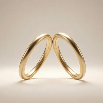 A slim gold wedding band set featuring a 2mm width in 9ct, 14ct, and 18ct gold by Majestic Jewellery.