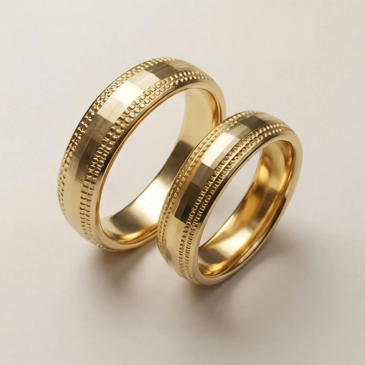 A 5mm gold wedding band with faceted milgrain detailing in 9ct gold, shown against a black background by Majestic Jewellery.