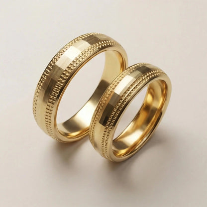 A 5mm gold wedding band with faceted milgrain detailing in 9ct gold, shown against a black background by Majestic Jewellery.